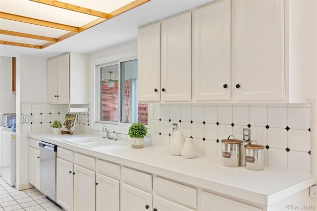 1420 E Bates Ave, Englewood, CO 80113 - kitchen with dishwasher, light countertops, white cabinetry, a sink, and backsplash