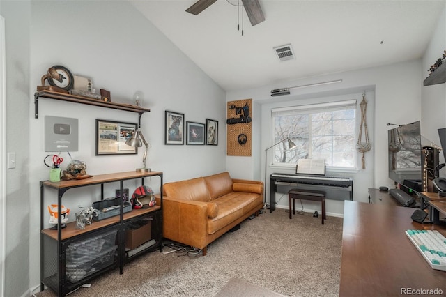 living area featuring visible vents, carpet flooring, baseboards, ceiling fan, and vaulted ceiling