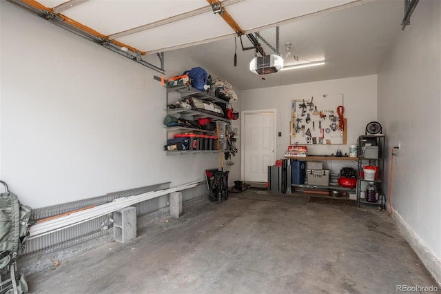 garage featuring a workshop area and a garage door opener