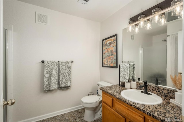 bathroom featuring toilet, visible vents, baseboards, walk in shower, and vanity