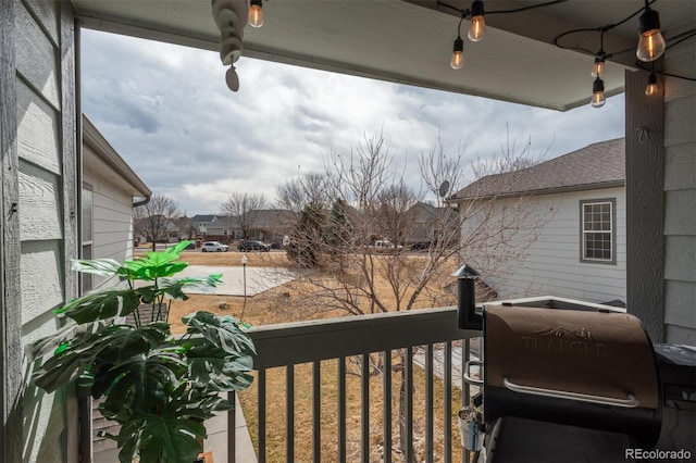 balcony featuring a grill and a residential view