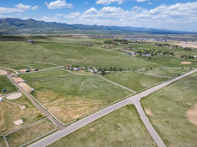 drone / aerial view featuring a mountain view and a rural view