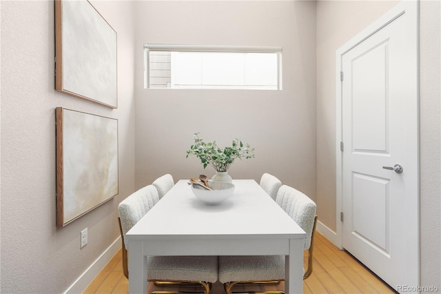 dining room with light hardwood / wood-style flooring