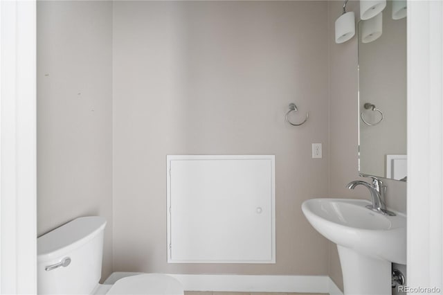 bathroom with sink and toilet