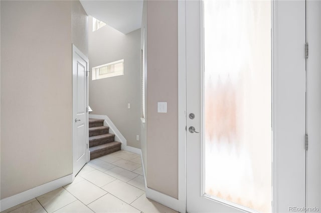 foyer entrance featuring light tile patterned floors