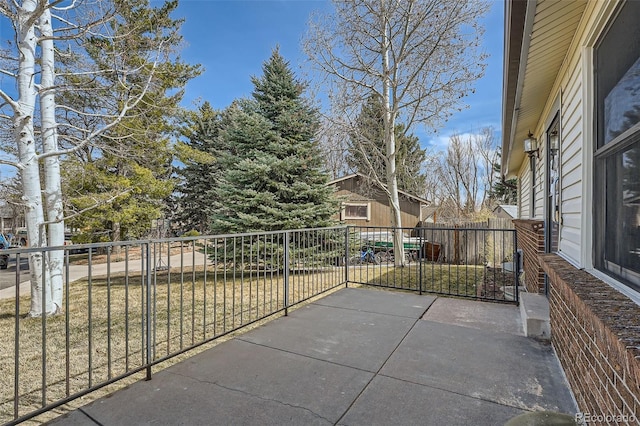 view of patio featuring fence