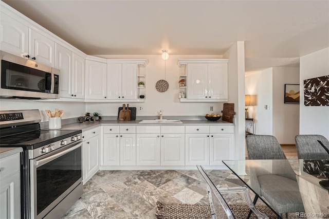 kitchen with a sink, open shelves, stainless steel appliances, white cabinets, and light countertops