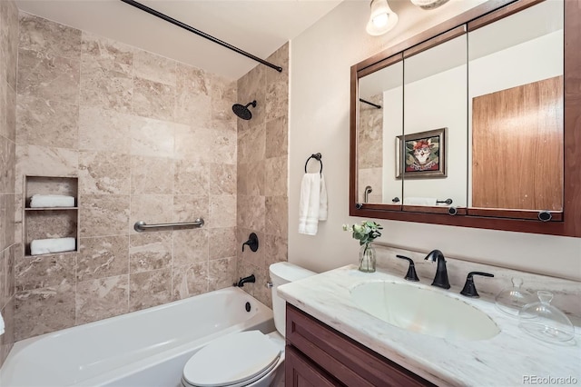 bathroom featuring vanity, shower / bathing tub combination, and toilet