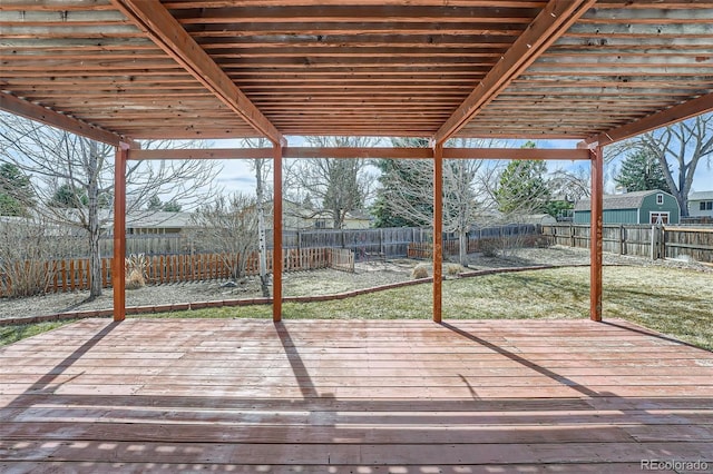 deck featuring a yard and a fenced backyard