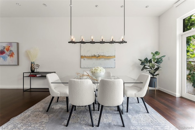 dining room featuring wood finished floors and baseboards