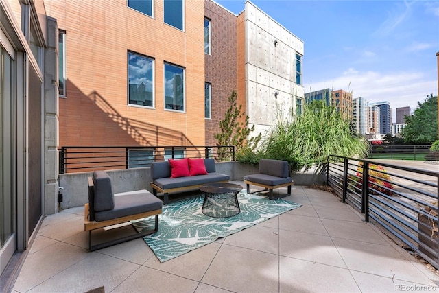 view of patio / terrace with an outdoor hangout area and a city view