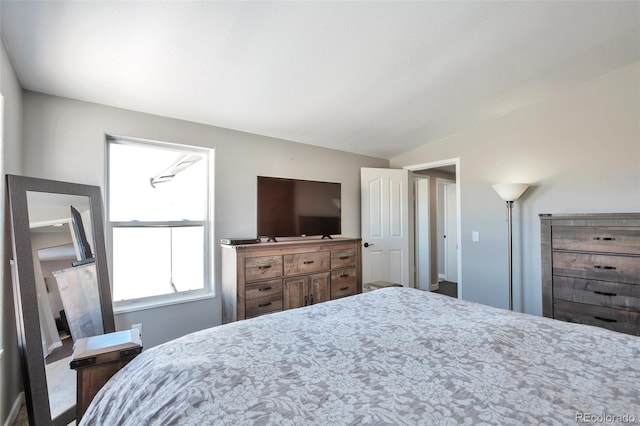 bedroom with vaulted ceiling