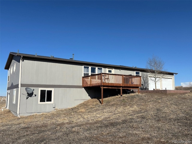 back of house with a deck