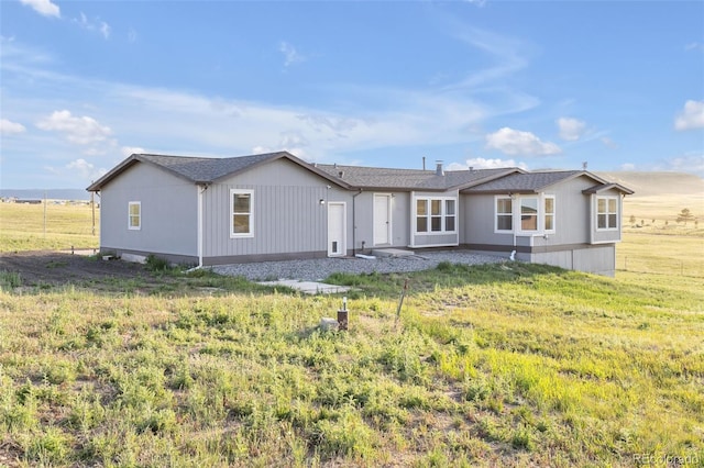 11100 Haskell Creek Rd, Larkspur, CO 80118 - rear view of property with a lawn