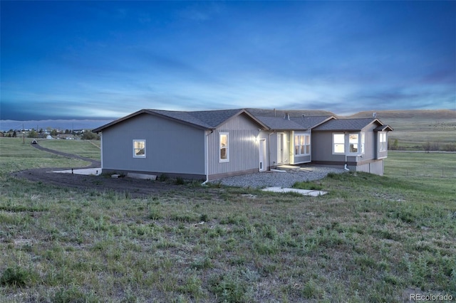 11100 Haskell Creek Rd, Larkspur, CO 80118 - property exterior at dusk with a yard