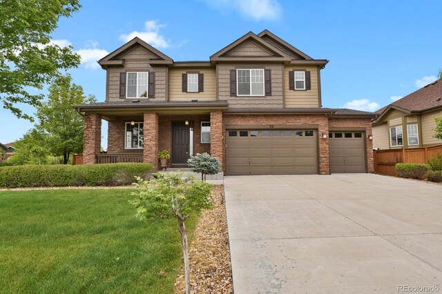 30 S Ider Way, Aurora, CO 80018 - craftsman house with driveway, a porch, brick siding, and a garage