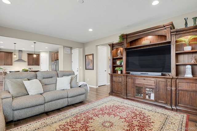 30 S Ider Way, Aurora, CO 80018 - living room featuring wood finished floors, recessed lighting, and baseboards