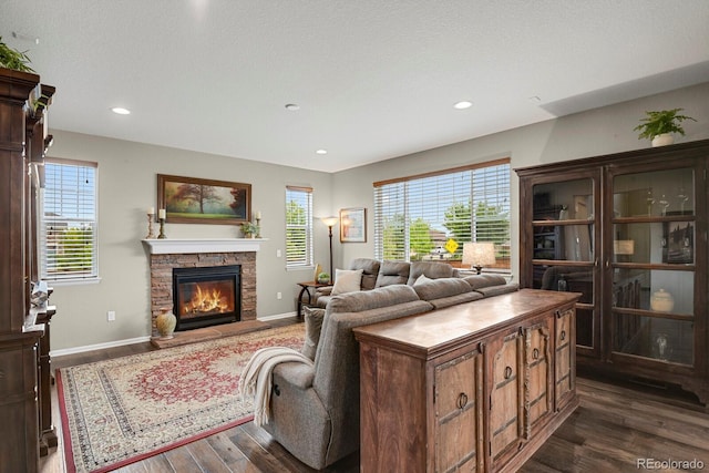30 S Ider Way, Aurora, CO 80018 - living room featuring dark wood finished floors, a fireplace, baseboards, and recessed lighting