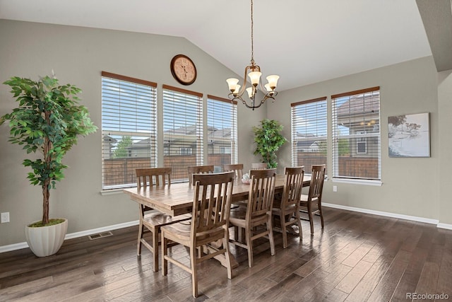 30 S Ider Way, Aurora, CO 80018 - dining area featuring dark wood-style flooring, lofted ceiling, baseboards, and a chandelier