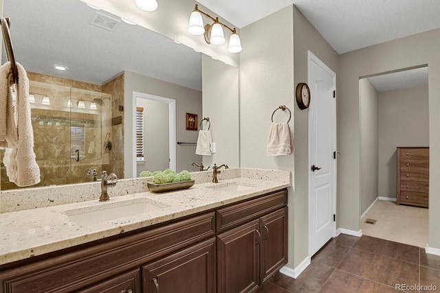 30 S Ider Way, Aurora, CO 80018 - full bathroom featuring double vanity, a stall shower, tile patterned floors, and baseboards
