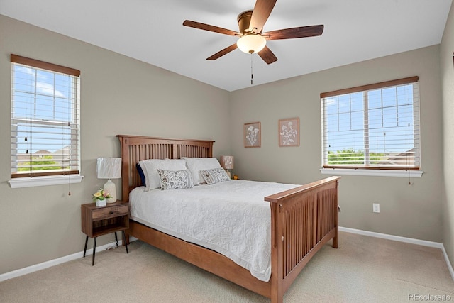 30 S Ider Way, Aurora, CO 80018 - carpeted bedroom with multiple windows, baseboards, and ceiling fan