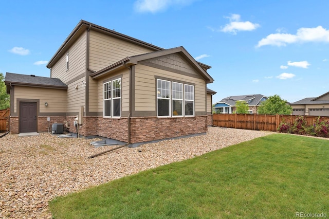 30 S Ider Way, Aurora, CO 80018 - view of side of home with central AC unit and stone siding