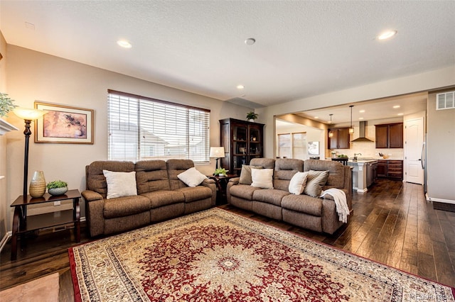 30 S Ider Way, Aurora, CO 80018 - living room featuring dark wood-type flooring and recessed lighting