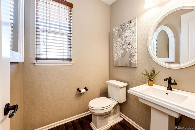 30 S Ider Way, Aurora, CO 80018 - bathroom featuring wood finished floors and toilet