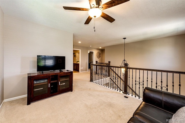30 S Ider Way, Aurora, CO 80018 - sitting room with carpet flooring, a ceiling fan, recessed lighting, and an upstairs landing