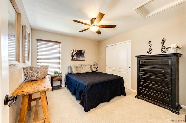 30 S Ider Way, Aurora, CO 80018 - bedroom with a closet, light colored carpet, attic access, and a ceiling fan