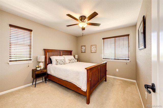 30 S Ider Way, Aurora, CO 80018 - bedroom with multiple windows, light colored carpet, and a ceiling fan