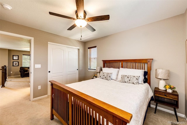 30 S Ider Way, Aurora, CO 80018 - bedroom featuring light carpet, a closet, and ceiling fan