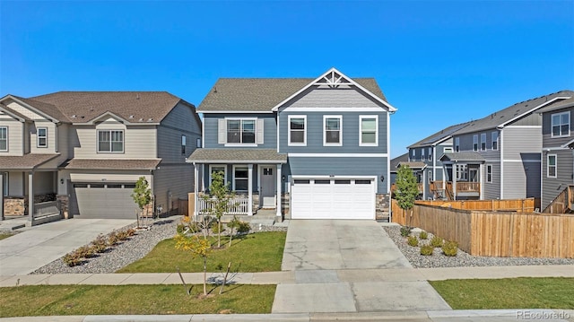 17415 Trefoil Ln, Parker, CO 80134 - view of front of house with a garage, stone siding, concrete driveway, and fence