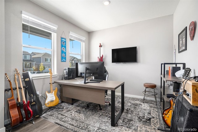 home office with hardwood / wood-style flooring