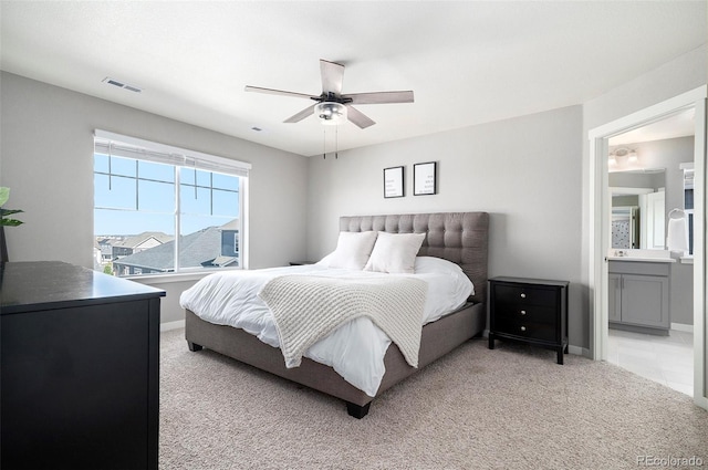 17415 Trefoil Ln, Parker, CO 80134 - bedroom with connected bathroom, ceiling fan, light carpet, baseboards, and visible vents