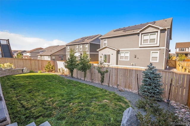 17415 Trefoil Ln, Parker, CO 80134 - back of property with a fenced backyard, a yard, and a residential view