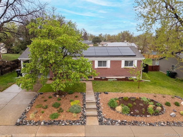 3379 W Wagon Trail Dr, Englewood, CO 80110 - view of front facade featuring solar panels and brick siding