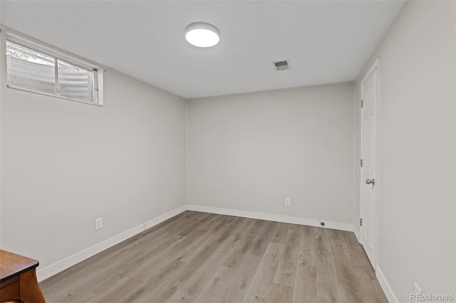 3379 W Wagon Trail Dr, Englewood, CO 80110 - below grade area featuring light wood-style flooring and baseboards