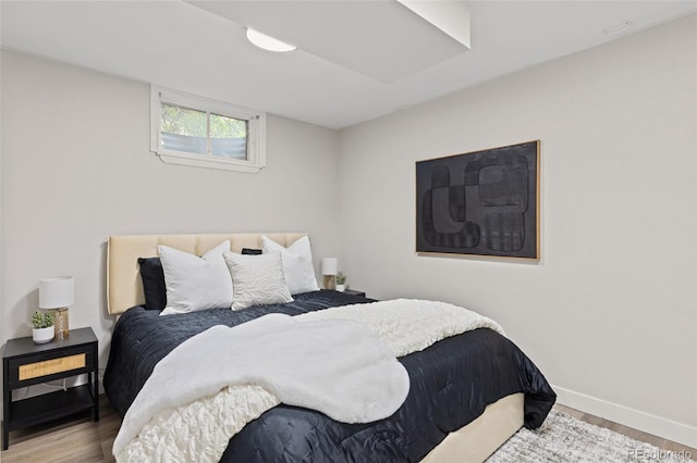3379 W Wagon Trail Dr, Englewood, CO 80110 - bedroom featuring wood finished floors and baseboards