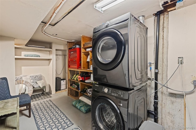 3379 W Wagon Trail Dr, Englewood, CO 80110 - laundry area featuring stacked washer / dryer