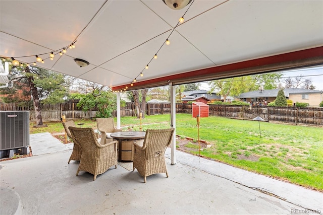 3379 W Wagon Trail Dr, Englewood, CO 80110 - view of patio with a storage shed, central AC, outdoor dining space, and an outdoor structure
