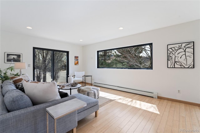 330 Ptarmigan St, Golden, CO 80403 - living area with a baseboard radiator, light wood-style floors, recessed lighting, and baseboards