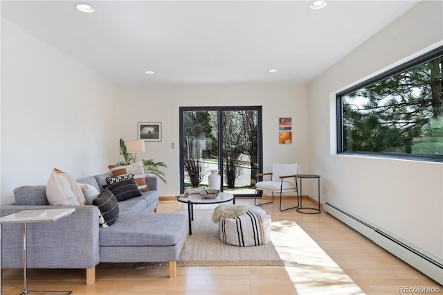 330 Ptarmigan St, Golden, CO 80403 - living room featuring a baseboard radiator, recessed lighting, and light wood finished floors