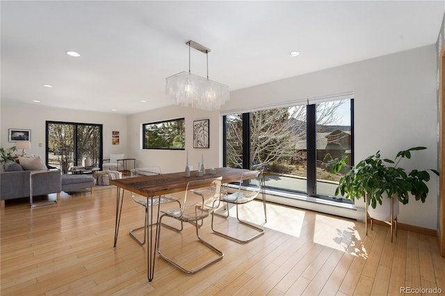 330 Ptarmigan St, Golden, CO 80403 - dining room with a baseboard heating unit, light wood-type flooring, recessed lighting, a chandelier, and baseboards