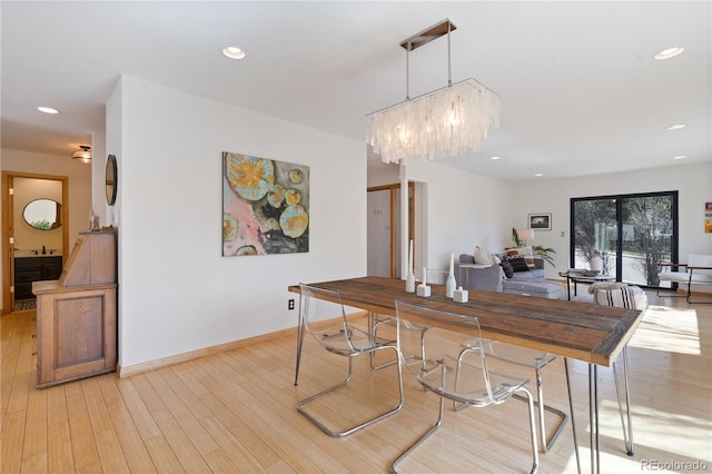 330 Ptarmigan St, Golden, CO 80403 - dining area with light wood-style flooring, a chandelier, recessed lighting, and baseboards