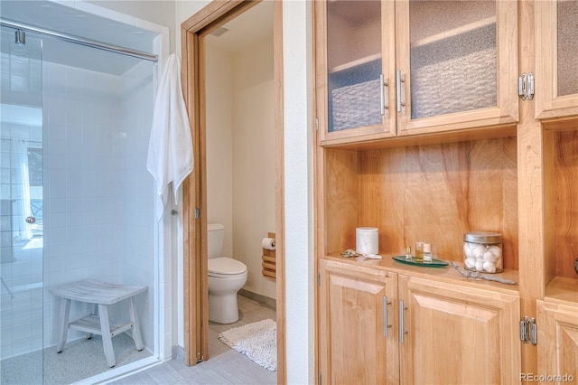 330 Ptarmigan St, Golden, CO 80403 - full bath featuring toilet, a stall shower, and tile patterned floors