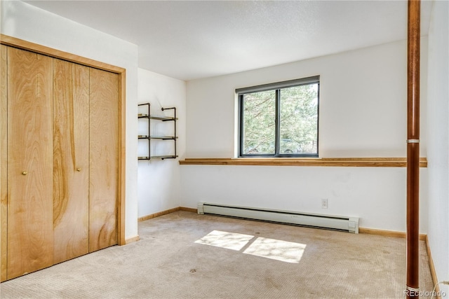330 Ptarmigan St, Golden, CO 80403 - unfurnished bedroom featuring baseboard heating, carpet, a closet, and baseboards