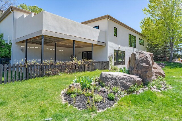 330 Ptarmigan St, Golden, CO 80403 - rear view of property featuring stucco siding and a balcony
