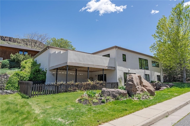 330 Ptarmigan St, Golden, CO 80403 - back of property featuring stucco siding and a balcony
