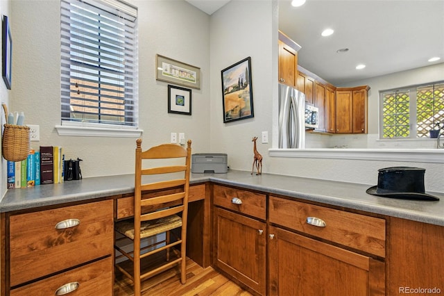 3240 Spruce St, Denver, CO 80238 - kitchen featuring stainless steel appliances, light wood-type flooring, brown cabinets, and recessed lighting
